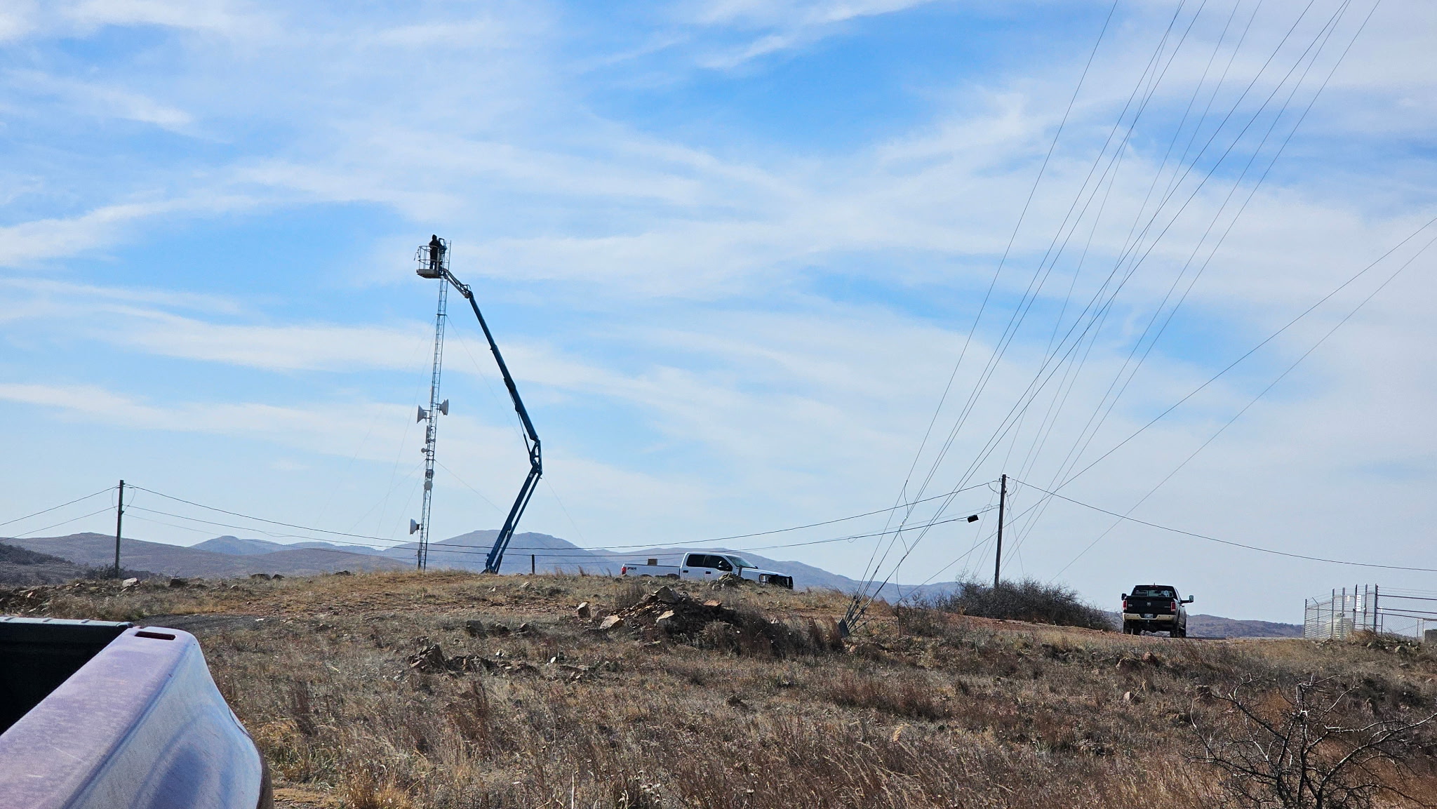 Crew deploying equipment at a tower site